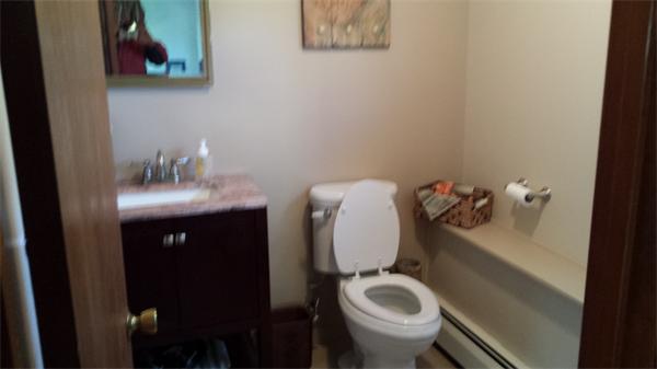 117 Mohawk Drive Seekonk, MA 02771 - Photo 15 of 16 a bathroom with a toilet sink and mirror