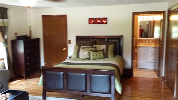 117 Mohawk Drive Seekonk, MA 02771 - Photo 3 of 16 a bedroom with a bed and wooden floor