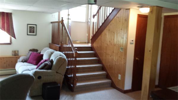 117 Mohawk Drive Seekonk, MA 02771 - Photo 10 of 16 a living room with furniture and stairs