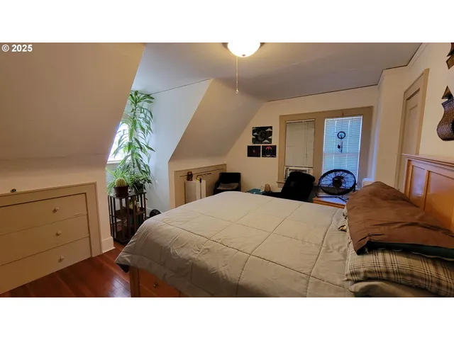 a room with a bed and a cabinets