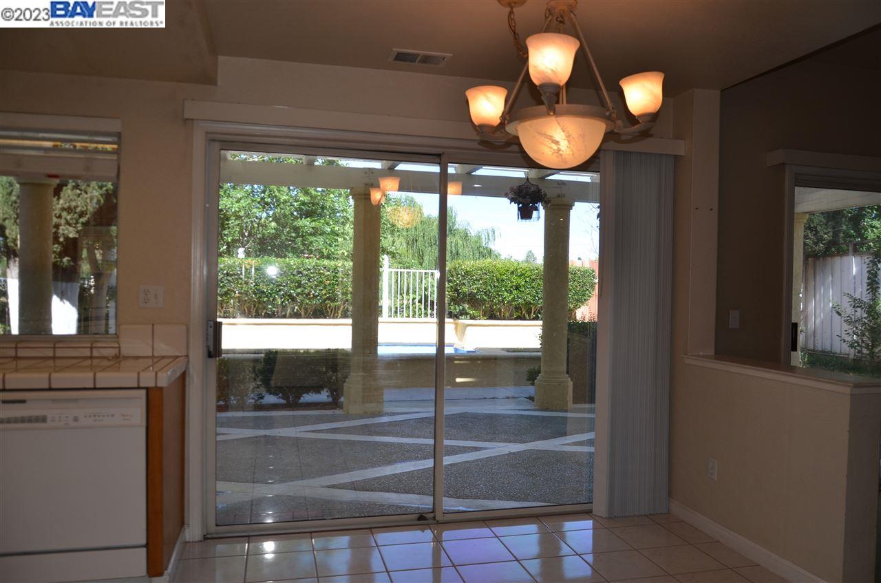 1463 Egret Drive Tracy, CA 95376 - Photo 8 of 19 a view of a porch with a floor to ceiling window and outside view