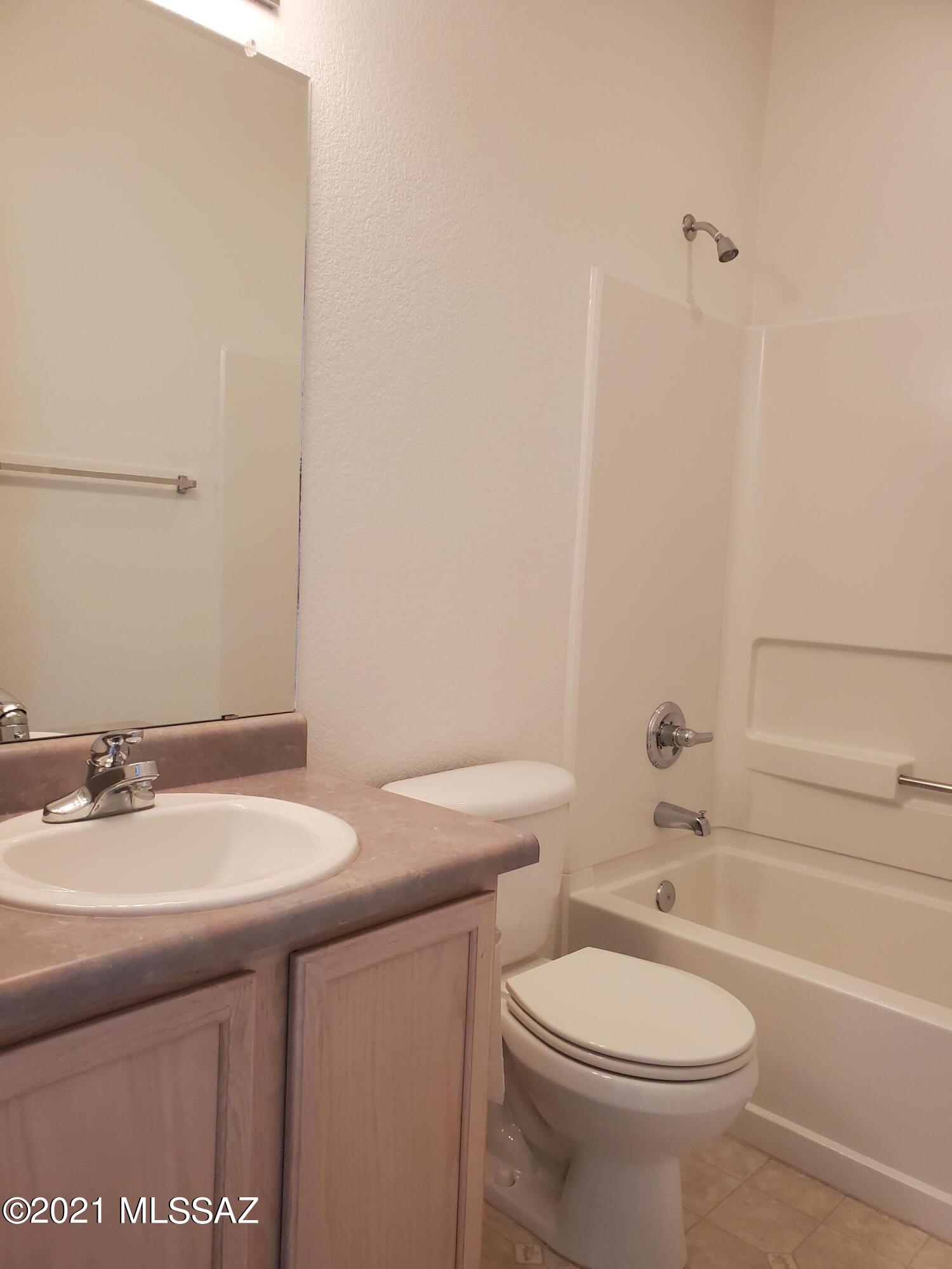 3455 North Boyce Spring Lane Tucson, AZ 85745 - Photo 10 of 21 a bathroom with a sink a toilet and shower