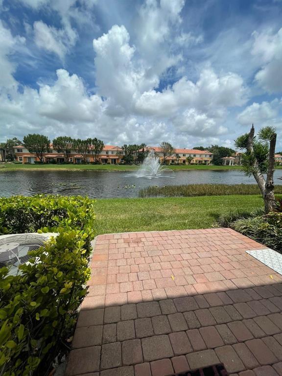 7445 Sarentino Lane, Unit 219 Boynton Beach, FL 33437 - Photo 11 of 12 a view of a lake with a yard