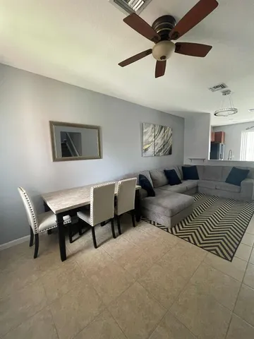 a bedroom with furniture and a chandelier