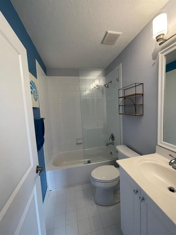 7445 Sarentino Lane, Unit 219 Boynton Beach, FL 33437 - Photo 7 of 12 a bathroom with a sink a toilet and shower