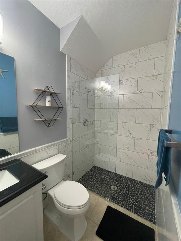 7445 Sarentino Lane, Unit 219 Boynton Beach, FL 33437 - Photo 10 of 12 a bathroom with a toilet and a shower