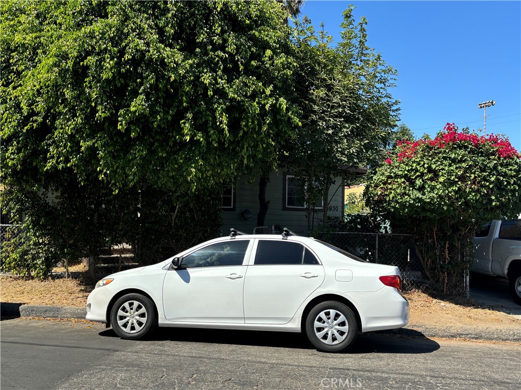 1930 Blake Avenue Los Angeles, CA 90039 - Photo 2 of 6 a car parked in front of a white house