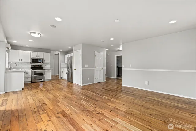 a view of kitchen with wooden floor