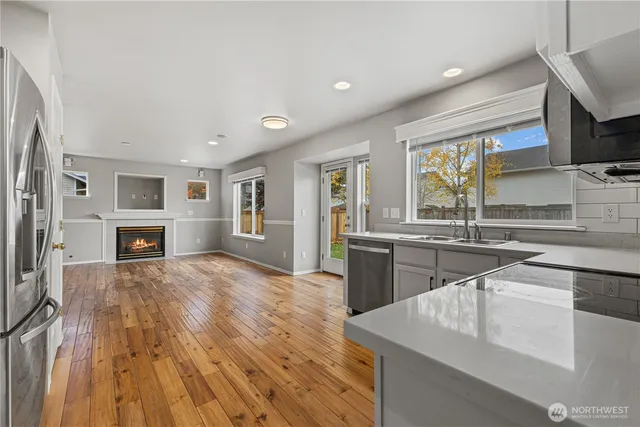 a kitchen with a refrigerator sink and microwave