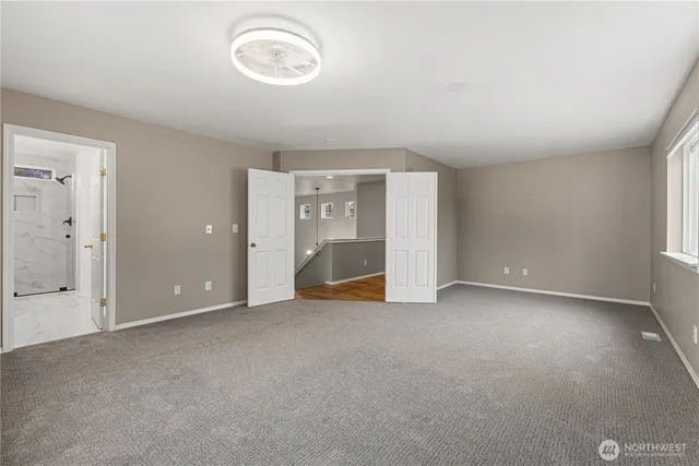 a bathroom with a double vanity sink mirror and shower