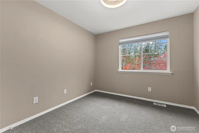 a bathroom with a sink vanity mirror and shower