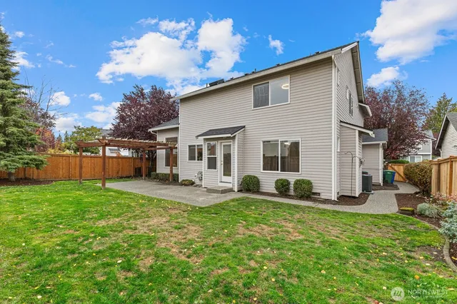 a view of a backyard with a small cabin