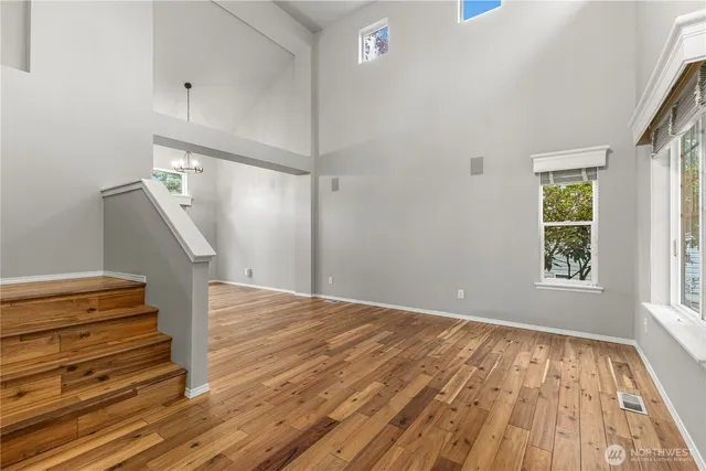 a view of entryway with wooden floor and stairs