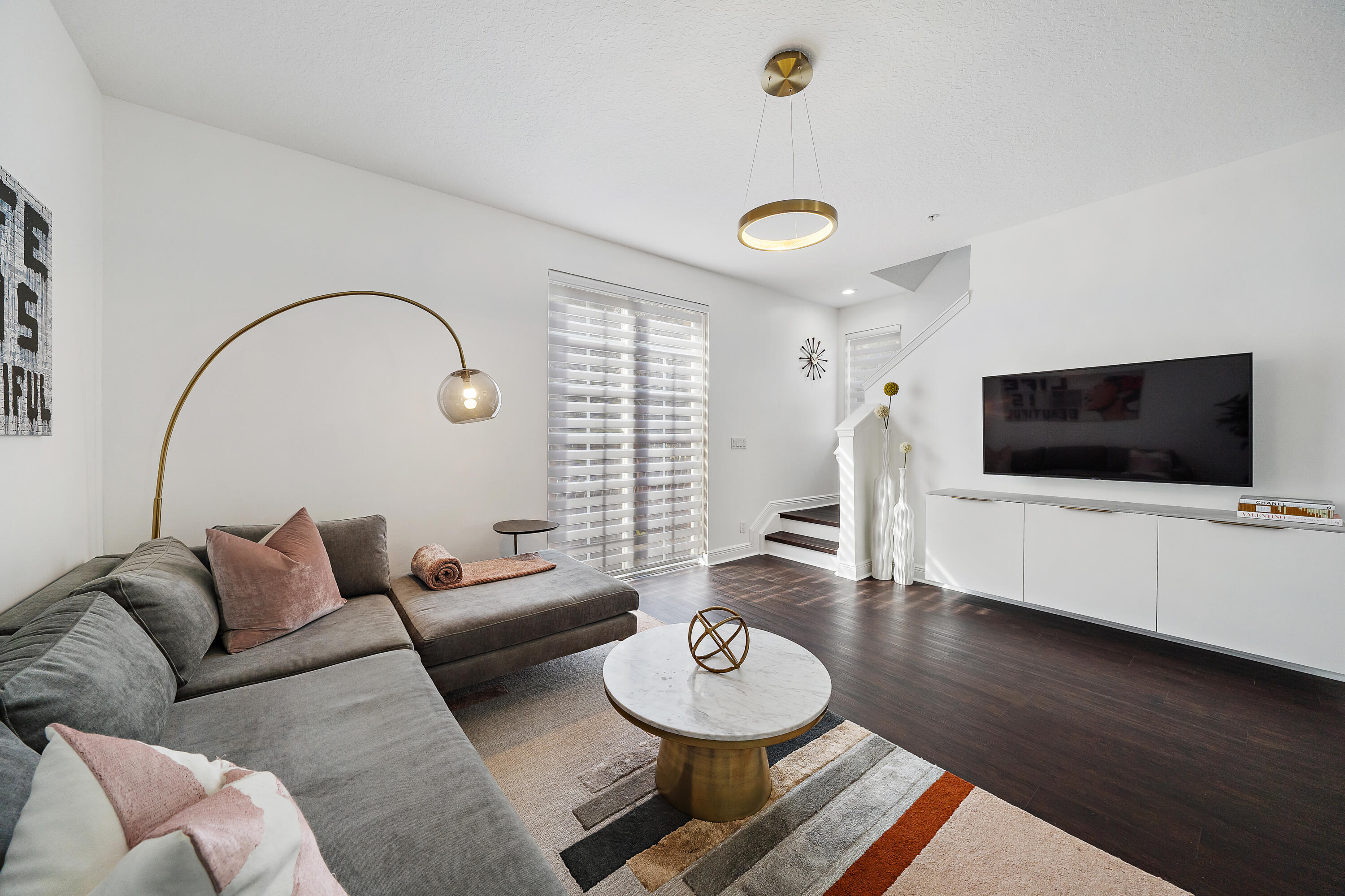 113 West Indian Crossing Circle Jupiter, FL 33458 - Photo 18 of 35 a living room with furniture and a flat screen tv