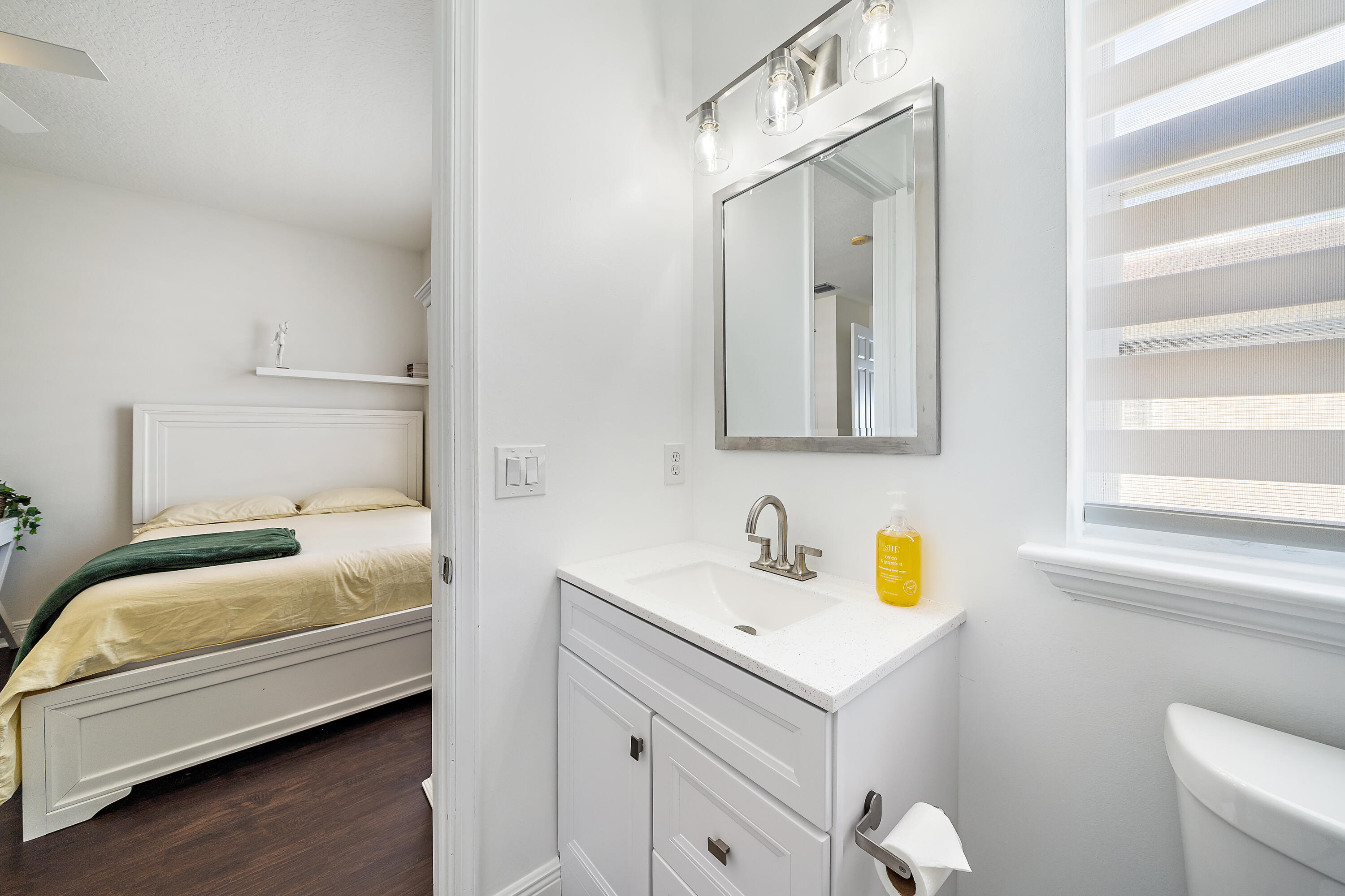 113 West Indian Crossing Circle Jupiter, FL 33458 - Photo 34 of 35 a bathroom with a sink and a mirror