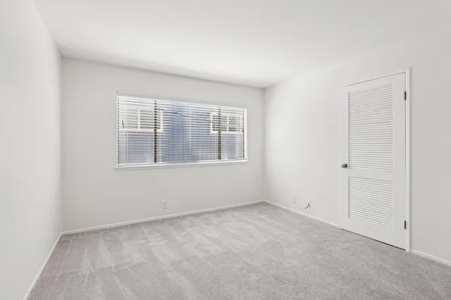 a view of empty room with windows