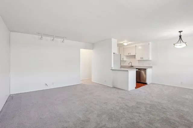 a view of a kitchen with a sink