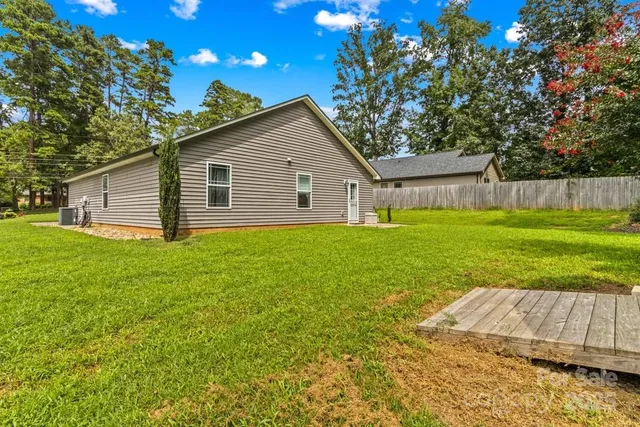 a view of backyard with a garden and entertaining space