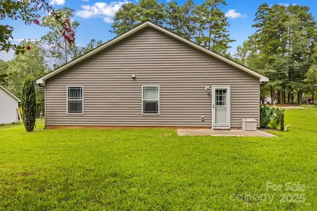 a house view with a backyard space