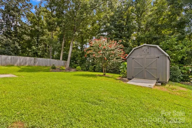 a view of swimming pool with a yard