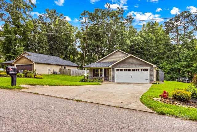 a view of front of house with a yard
