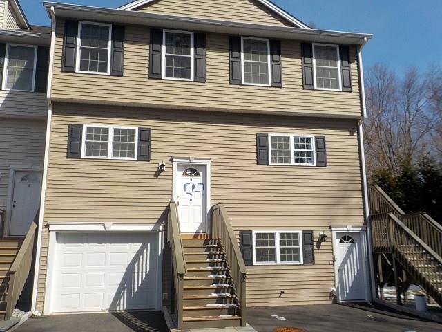 697 Beacon Valley Road, Unit 9 Naugatuck, CT 06770 - Photo 1 of 1 a front view of a house