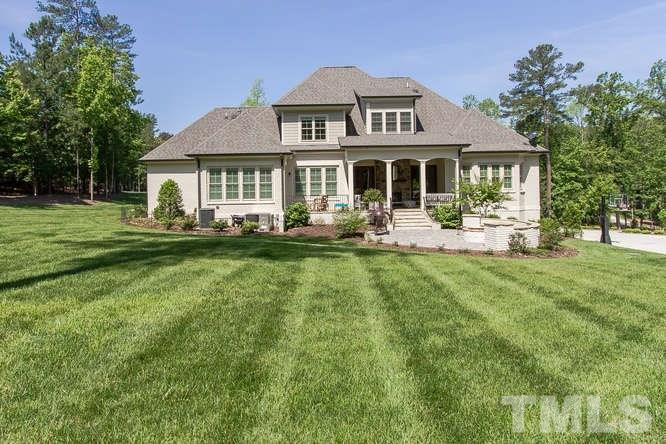 6008 Valencia Court Raleigh, NC 27614 - Photo 22 of 25 a front view of a house with a garden