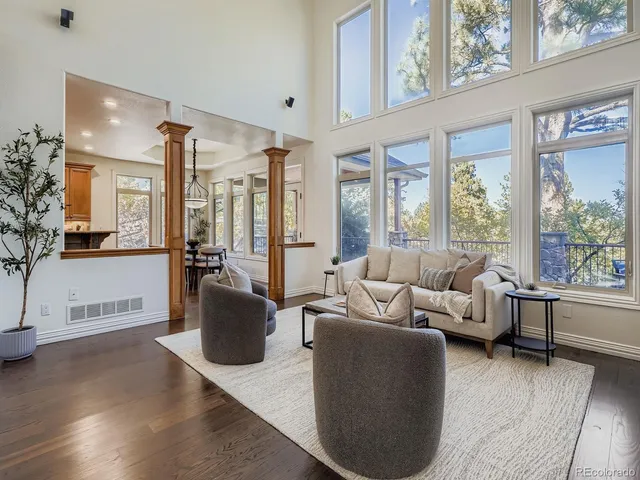 a view of a dining room with furniture wooden floor and chandelier