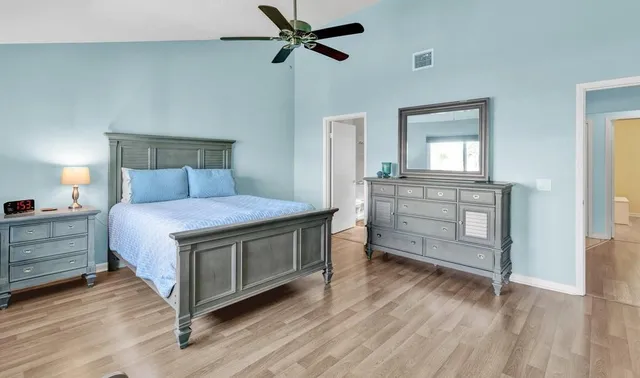 a bedroom with a bed and a dresser