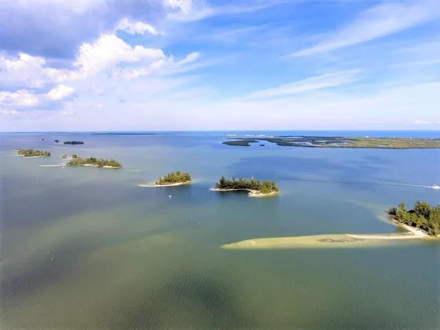 an aerial view of a houses with an outdoor space