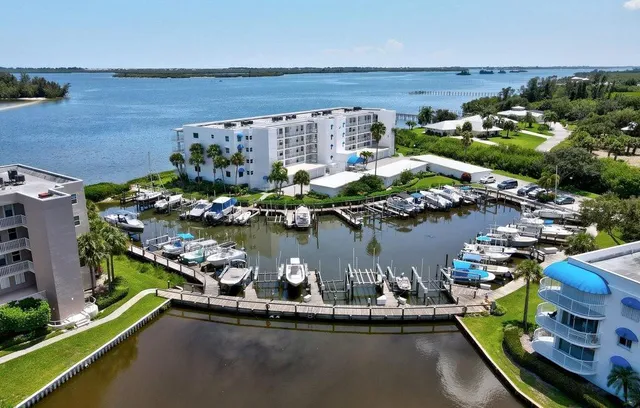 an aerial view of a house with a lake view