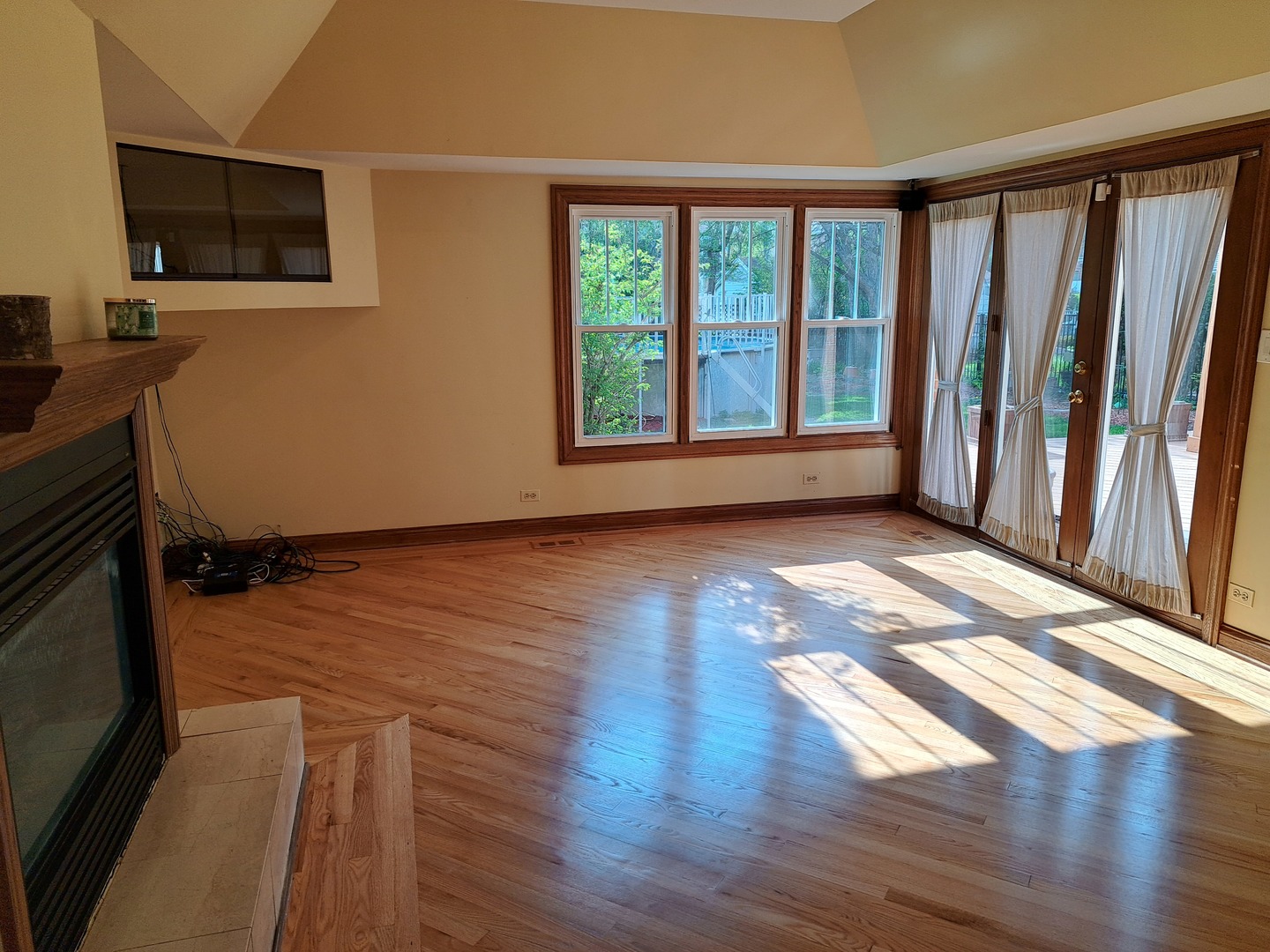 Undisclosed Address Park Ridge, IL 60068 - Photo 11 of 25 a view of an empty room with wooden floor and a window