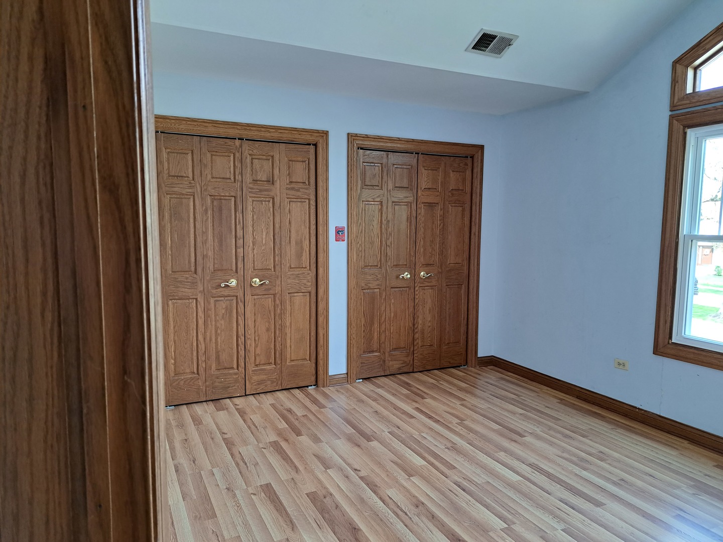 Undisclosed Address Park Ridge, IL 60068 - Photo 18 of 25 a view of an empty room with wooden floor and a window