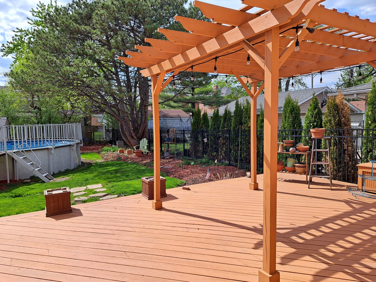 Undisclosed Address Park Ridge, IL 60068 - Photo 25 of 25 a patio with a table and chairs and wooden fence