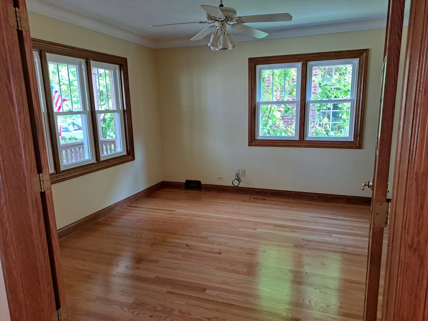 Undisclosed Address Park Ridge, IL 60068 - Photo 6 of 25 an empty room with wooden floor and windows