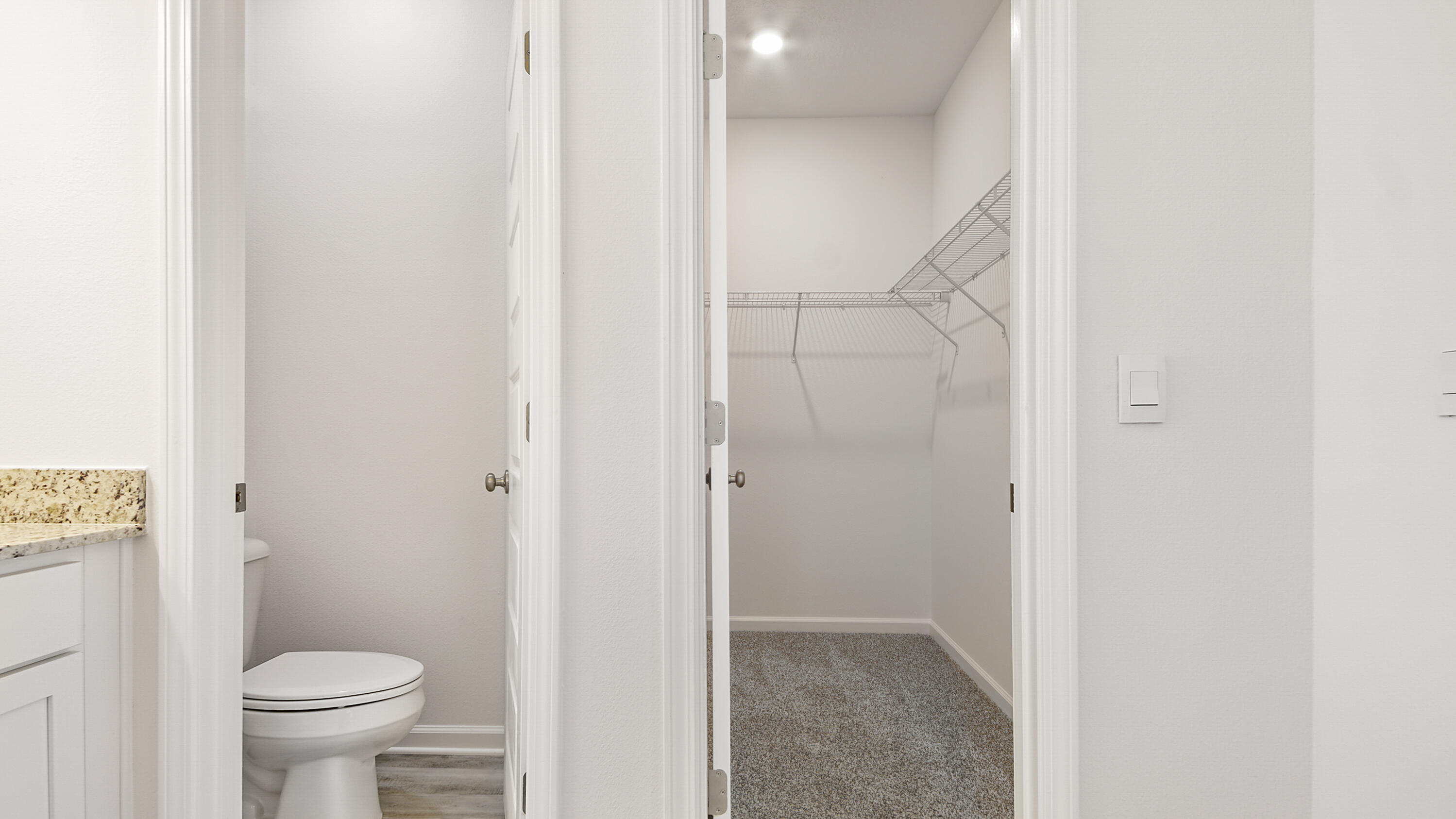 515 Bluebeech Street Freeport, FL 32439 - Photo 20 of 32 a bathroom with a granite countertop toilet and a sink