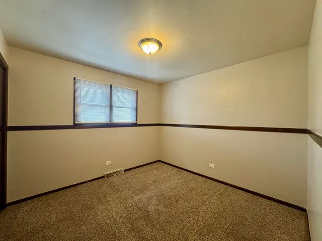 a view of a room with a large window