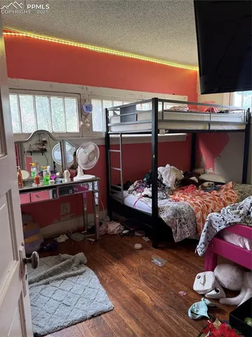 a bedroom with furniture and a dresser