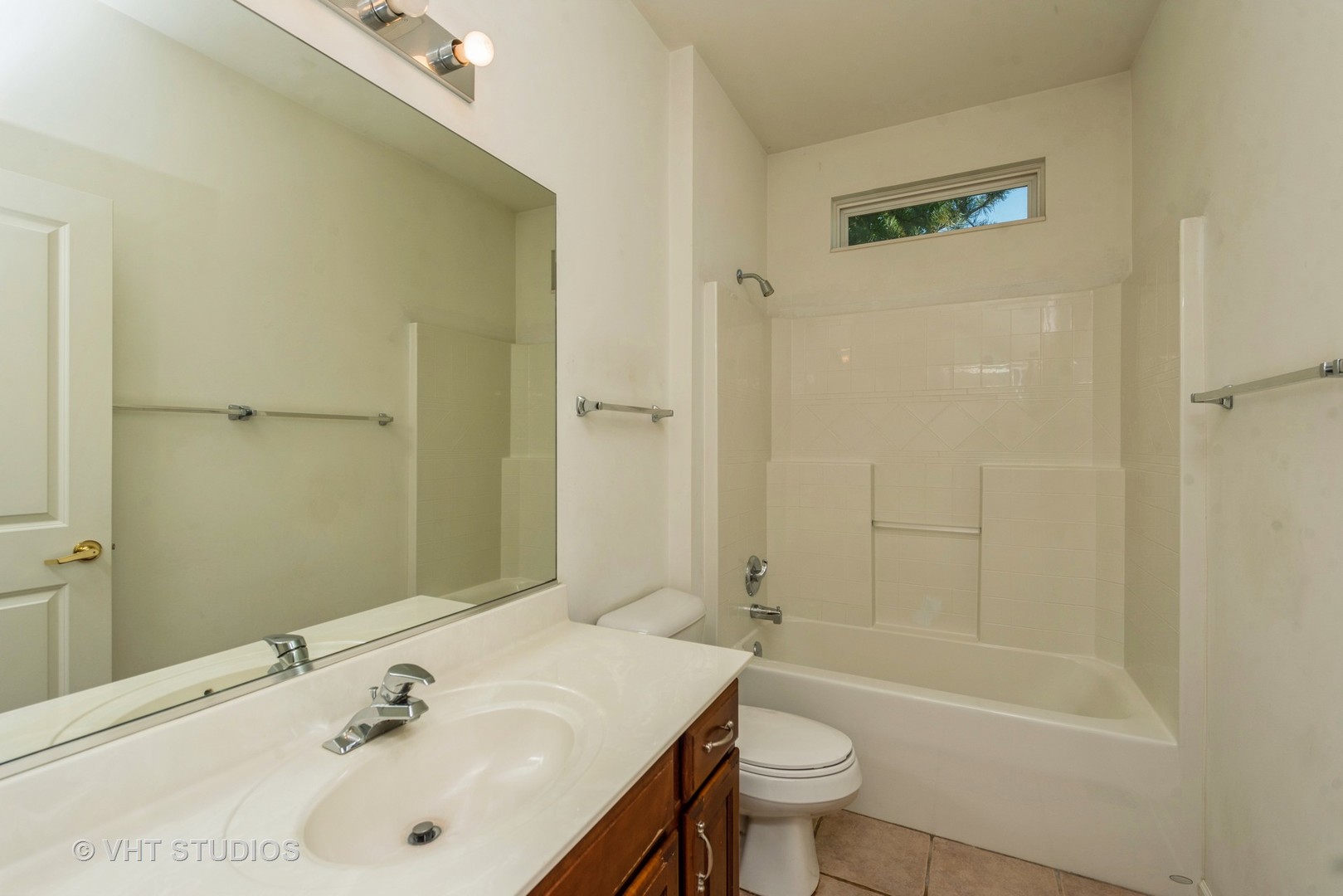 13065 Big Horn Drive Huntley, IL 60142 - Photo 12 of 14 a bathroom with a sink a toilet and shower