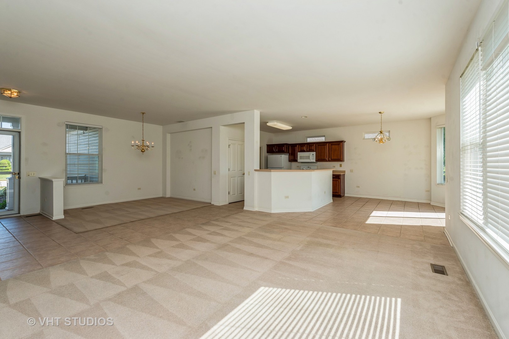 13065 Big Horn Drive Huntley, IL 60142 - Photo 4 of 14 a view of a kitchen with a sink cabinets and a window