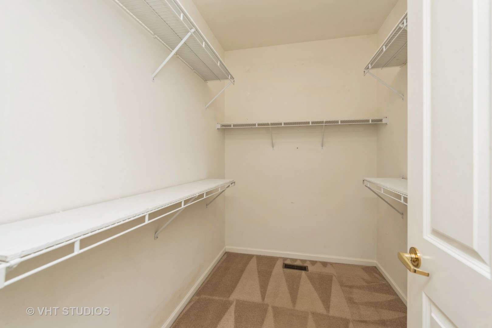 13065 Big Horn Drive Huntley, IL 60142 - Photo 9 of 14 a view of a room with racks on the wall