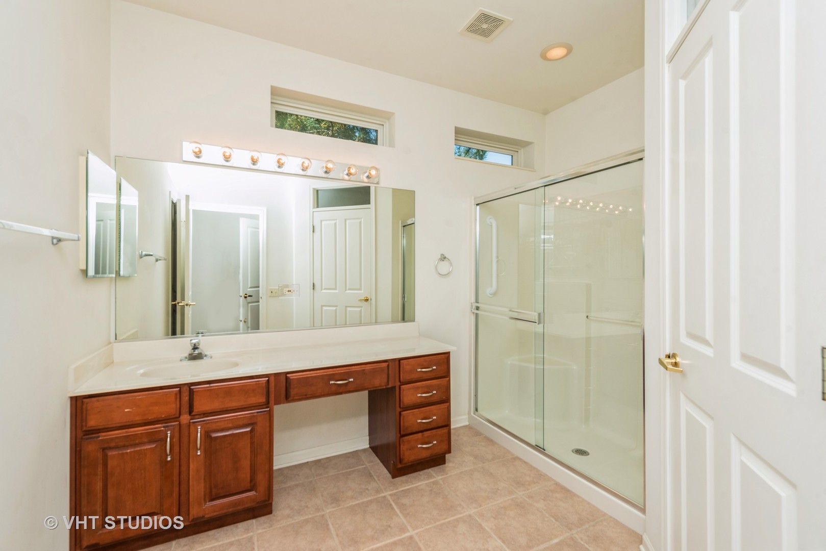 13065 Big Horn Drive Huntley, IL 60142 - Photo 10 of 14 a bathroom with a double vanity sink mirror and shower