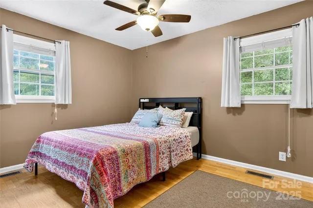 a dining table chair next to a window