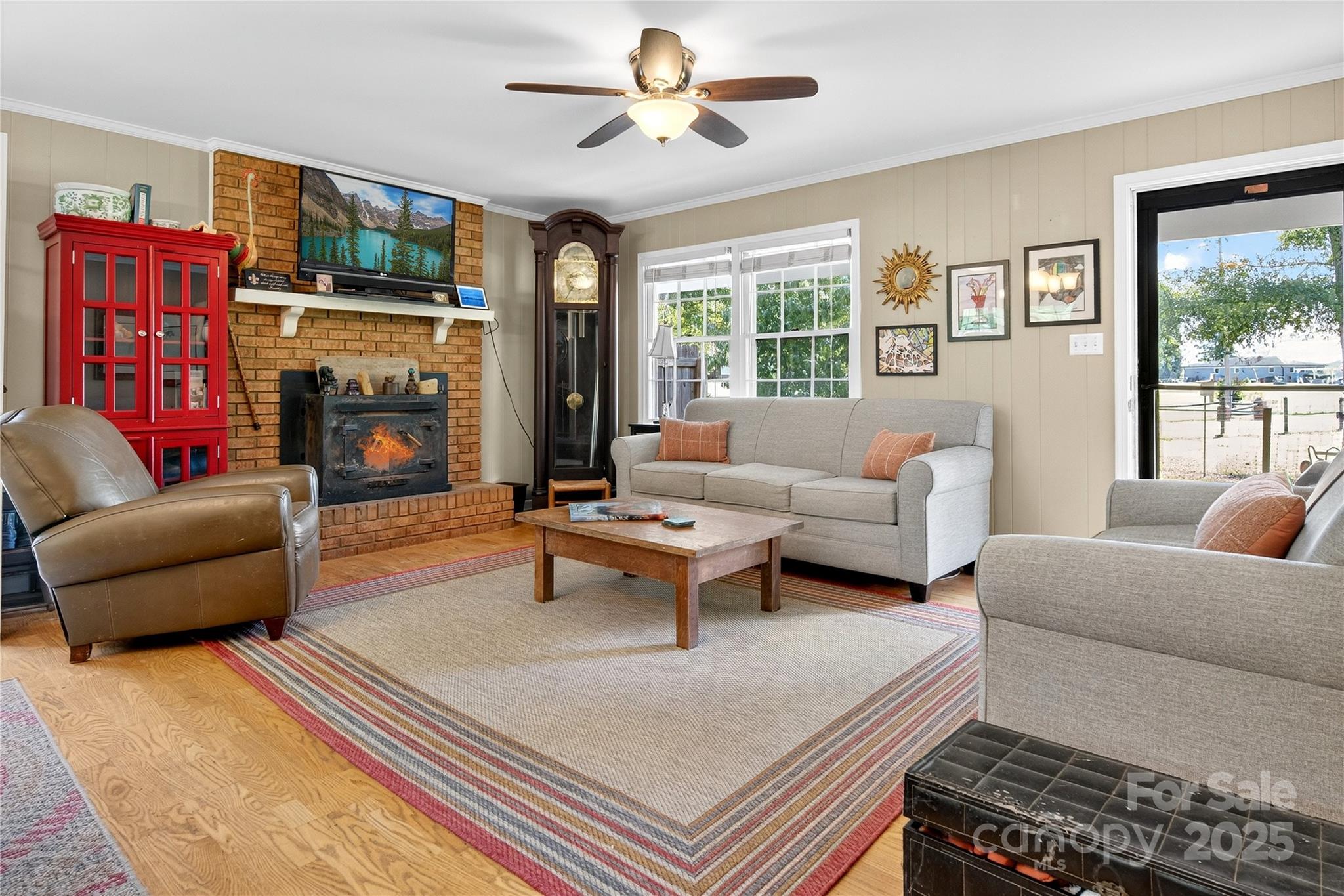 205 Airport Road Monroe, NC 28110 - Photo 25 of 32 a living room with fireplace furniture and a flat screen tv