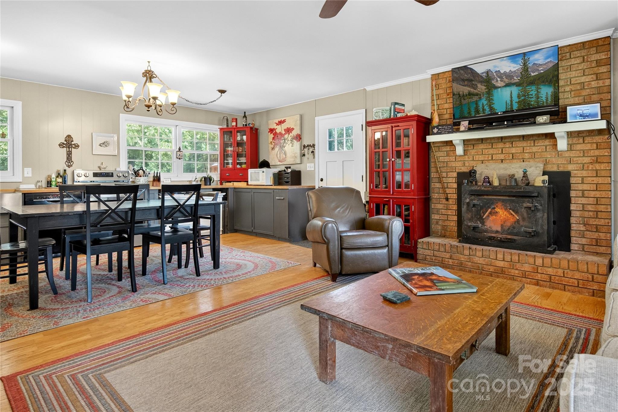 205 Airport Road Monroe, NC 28110 - Photo 28 of 32 a living room with furniture a flat screen tv and a fireplace