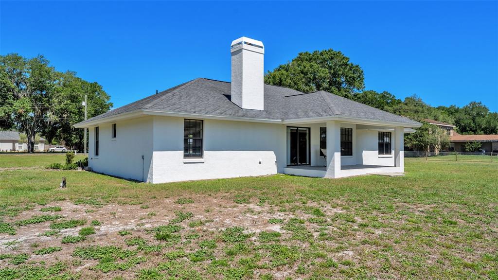 8525 North Campbell Road Lakeland, FL 33810 - Photo 11 of 45 a front view of a house with garden