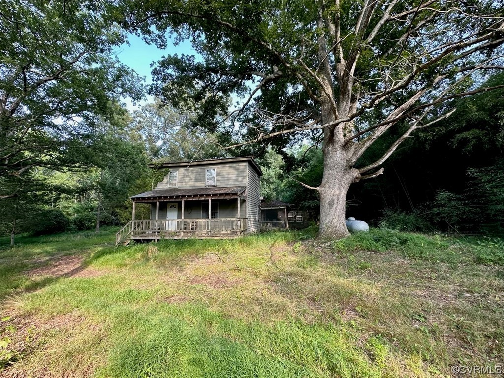4006 Belle Meade Road Bumpass, VA 23024 - Photo 2 of 3 a view of a house with garden and sitting area