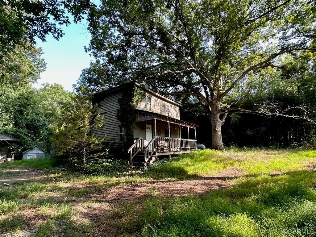 4006 Belle Meade Road Bumpass, VA 23024 - Photo 3 of 3 a house that has a tree in front of it