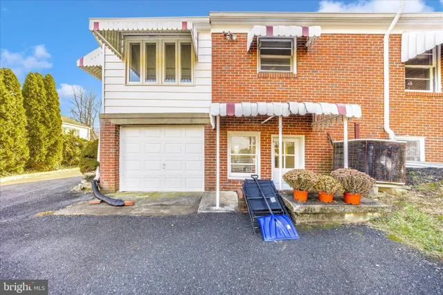 a kitchen with a stove sink and refrigerator