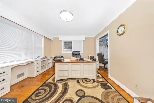 a view of a kitchen with a dining table and chairs